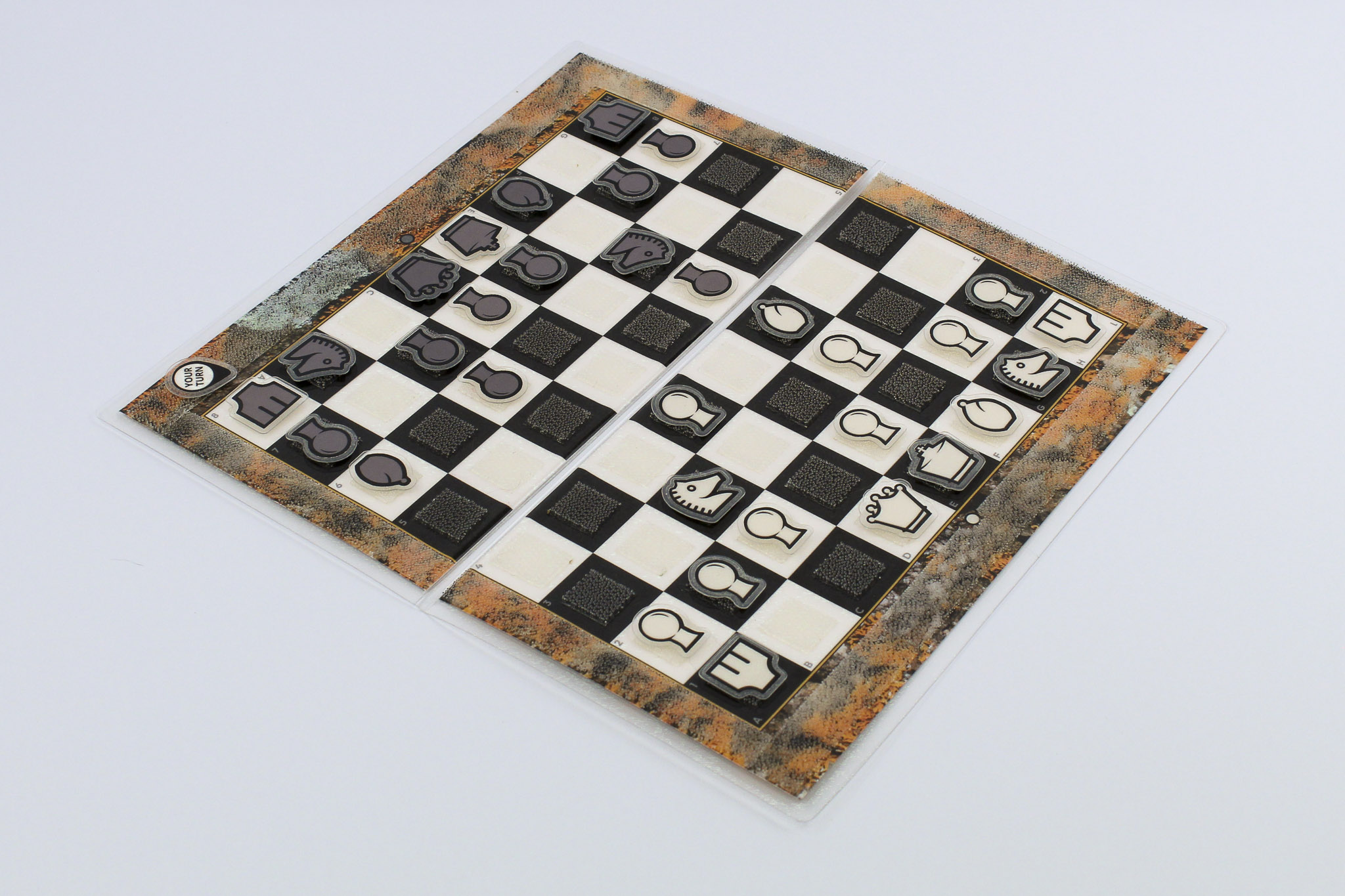 Open Travel Chessboard with Orange Lichen design and a game in progress on a white background.